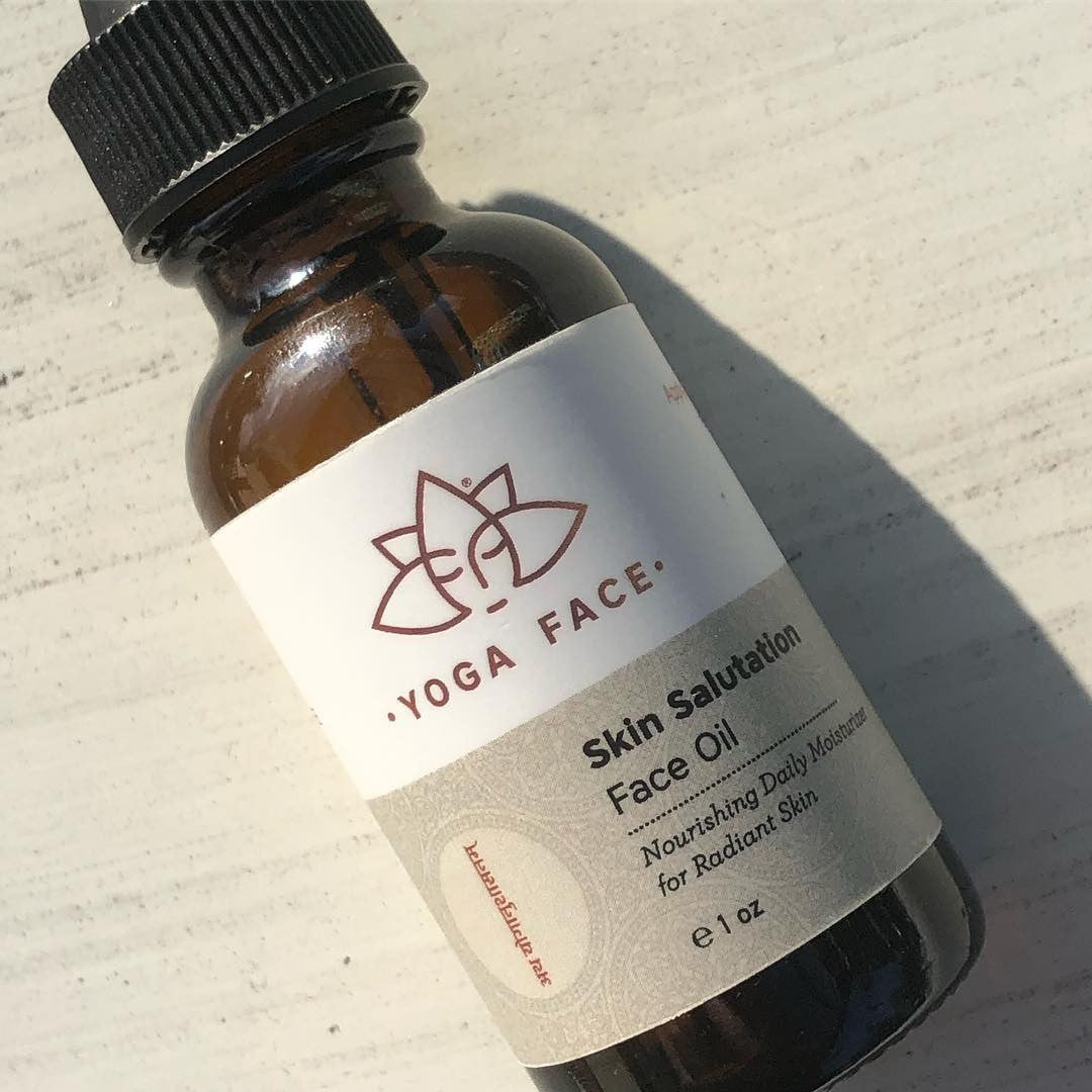 Skin Salutation Face Oil bottle and botanical face care ritual by YogaFace